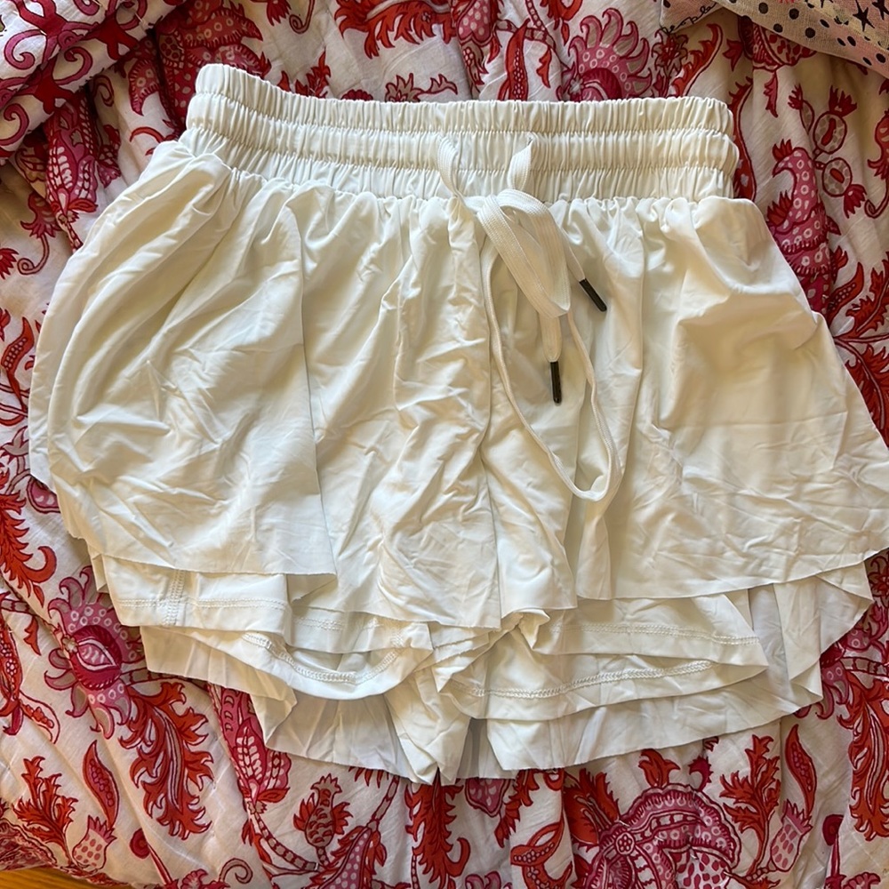 white kikikona butterfly flowy shorts